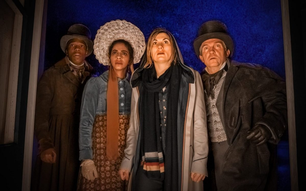 Thirteenth Doctor, Yaz, Graham, and Ryan stand together in historical wear in the Haunting of Villa Diodati episode