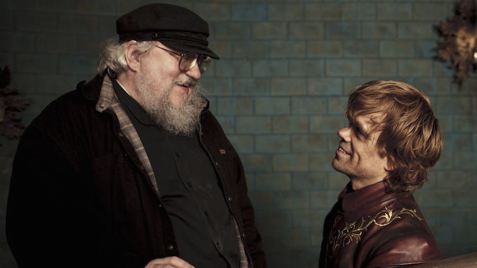 george rr martin stands with peter dinklage on game of thrones set