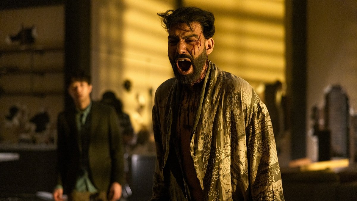 Napoleon Usher (Rahul Kohli), disheveled and covered in blood, screams in The Fall of the House of Usher.