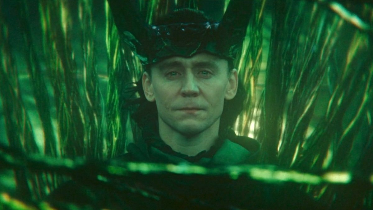King Loki sits with the green strands of timelines