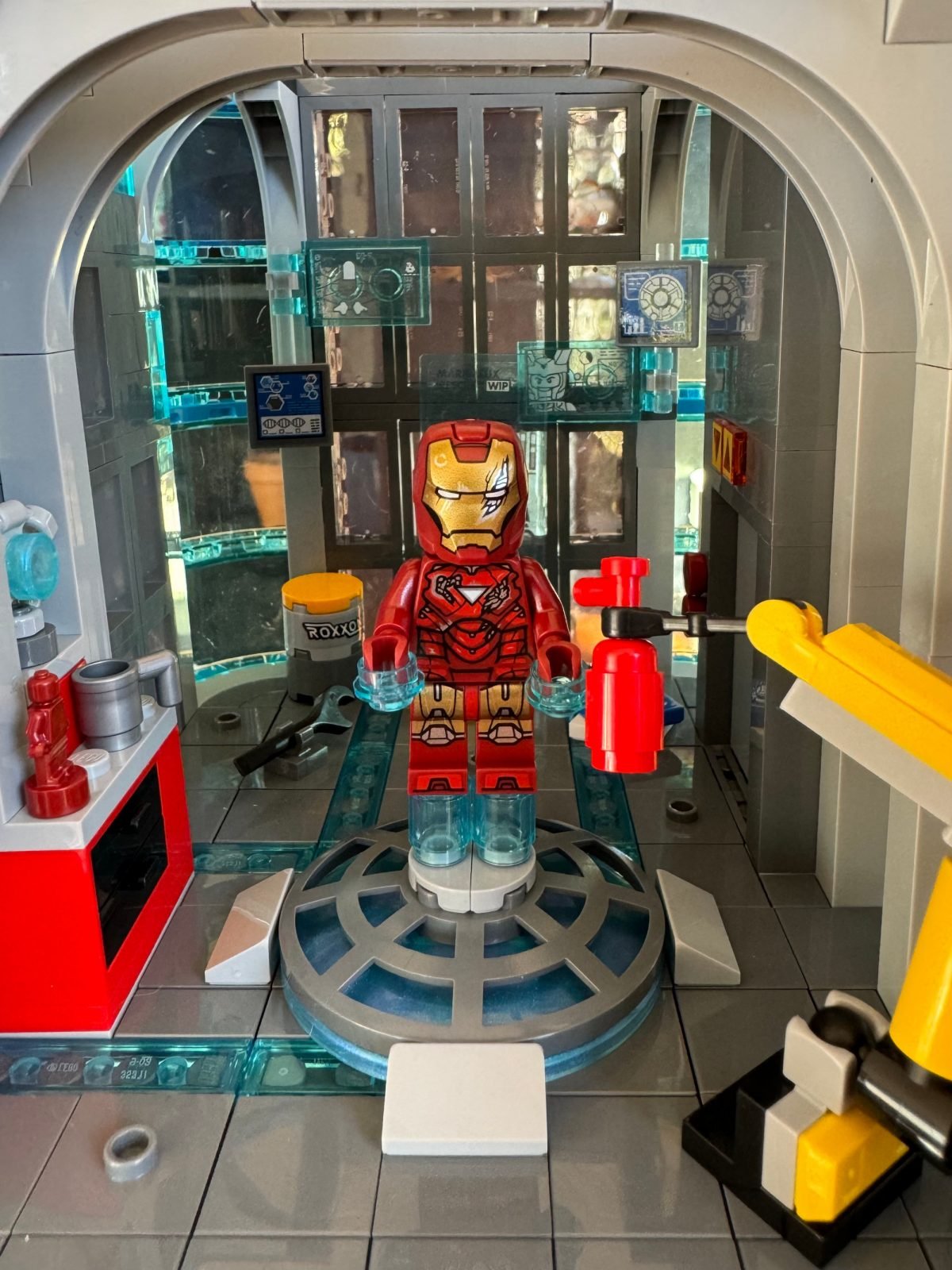 A damaged Iron Man minifig in a chamber