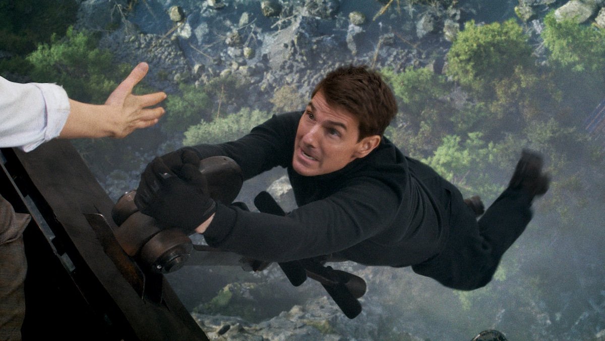 Tom Cruise hangs over a cliff in Mission: Impossible - Dead Reckoning Part One