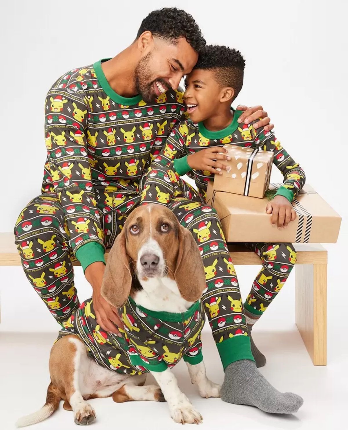 A father, son, and dog in matching Pokemon long john pajamas from Hanna Andersson
